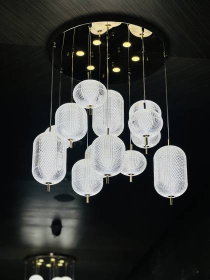 Crystal cluster chandelier made and installed by SARA Enterprises in a double-height lobby