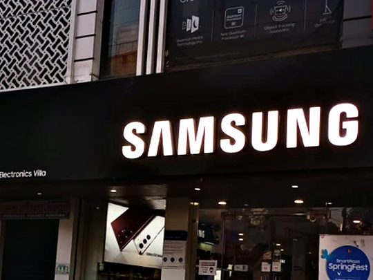 Illuminated dimensional lettering on a dark ACP storefront fascia, sized to stay legible against the lit shopfront below it.