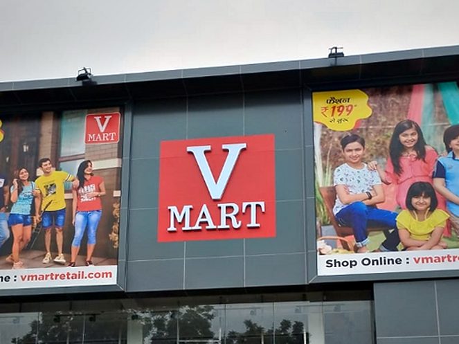 ACP store fascia with a dimensional brand block and printed campaign panels across a two-level retail frontage.