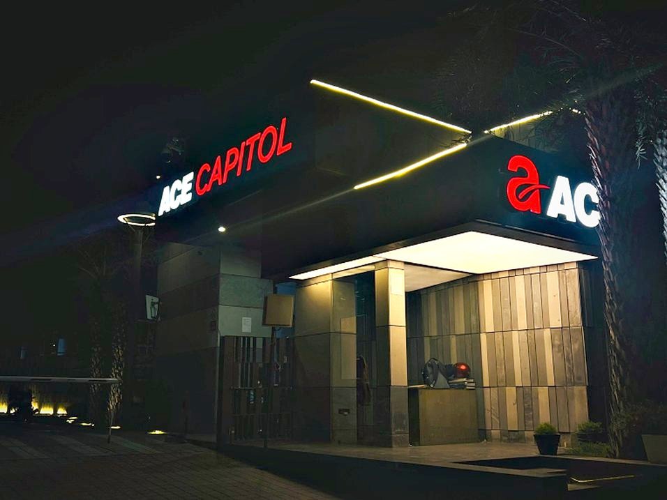 Illuminated entrance identity with a linear light detail running the length of the canopy soffit.