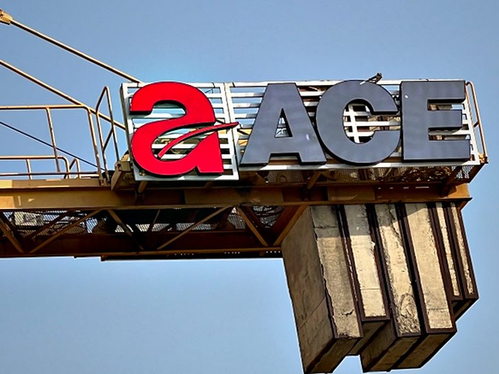 Brand letters mounted to a fabricated steel support structure, built and set out in-house before lifting.