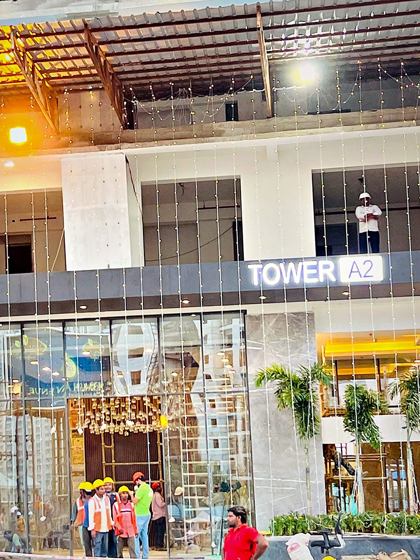 Tower identification signage on a residential block, sized so residents and visitors can pick the tower out from the internal road.